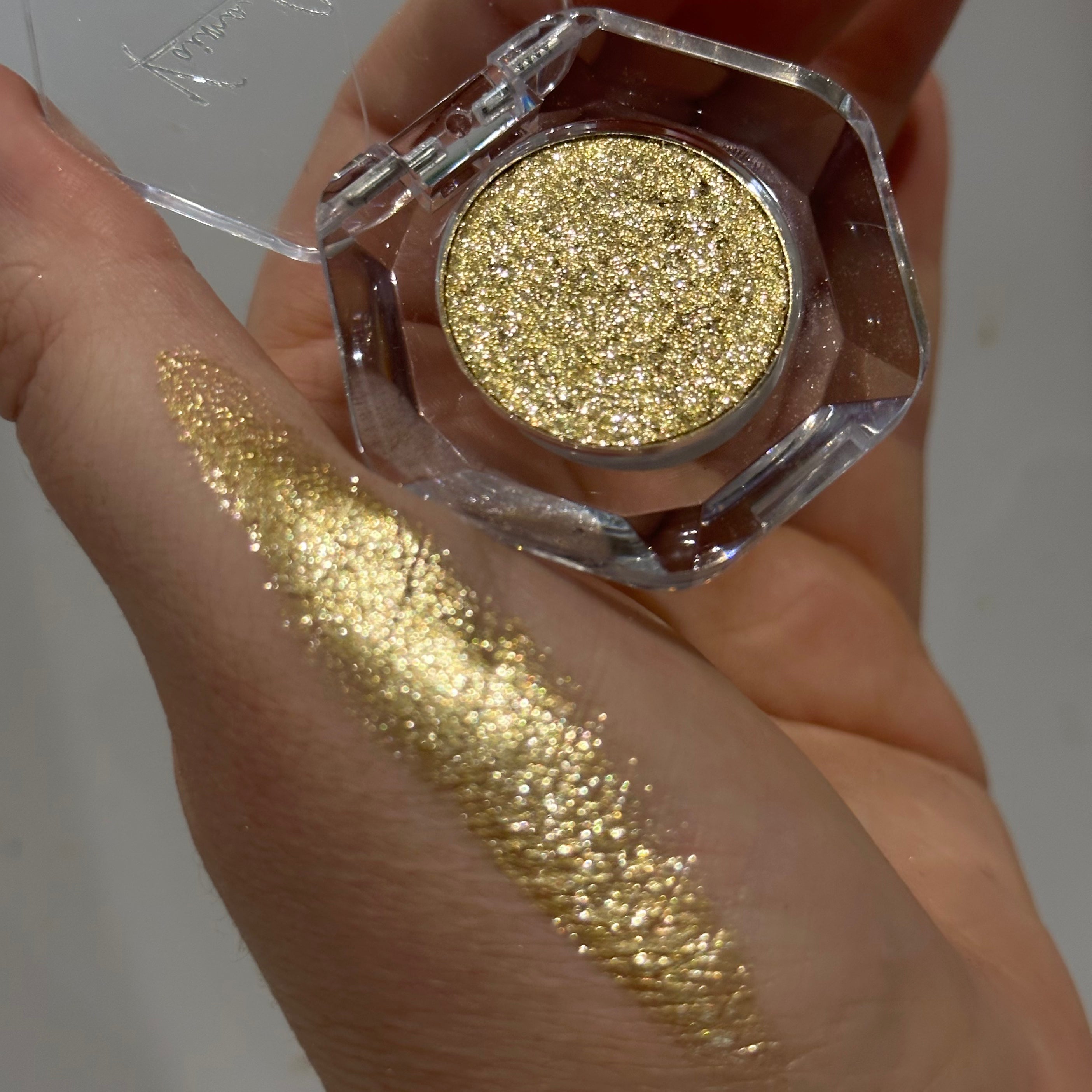 Gold glitter eyeshadow swatch